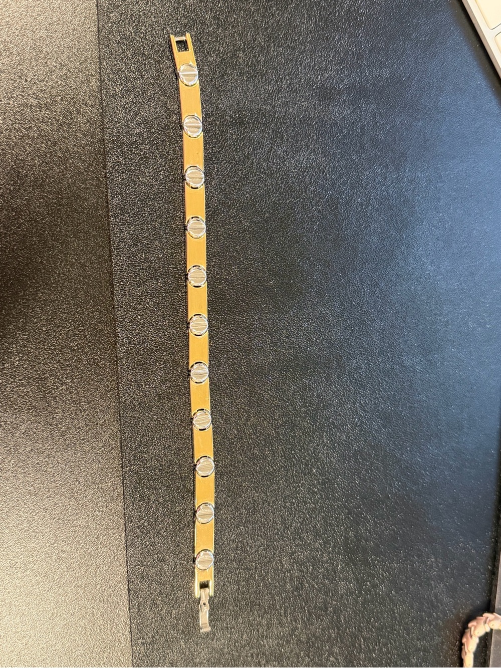 Gold-tone magnetic bracelet with silvertone nail-head accents
